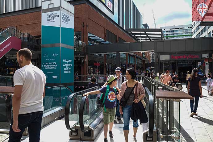 london designer outlet escalators people